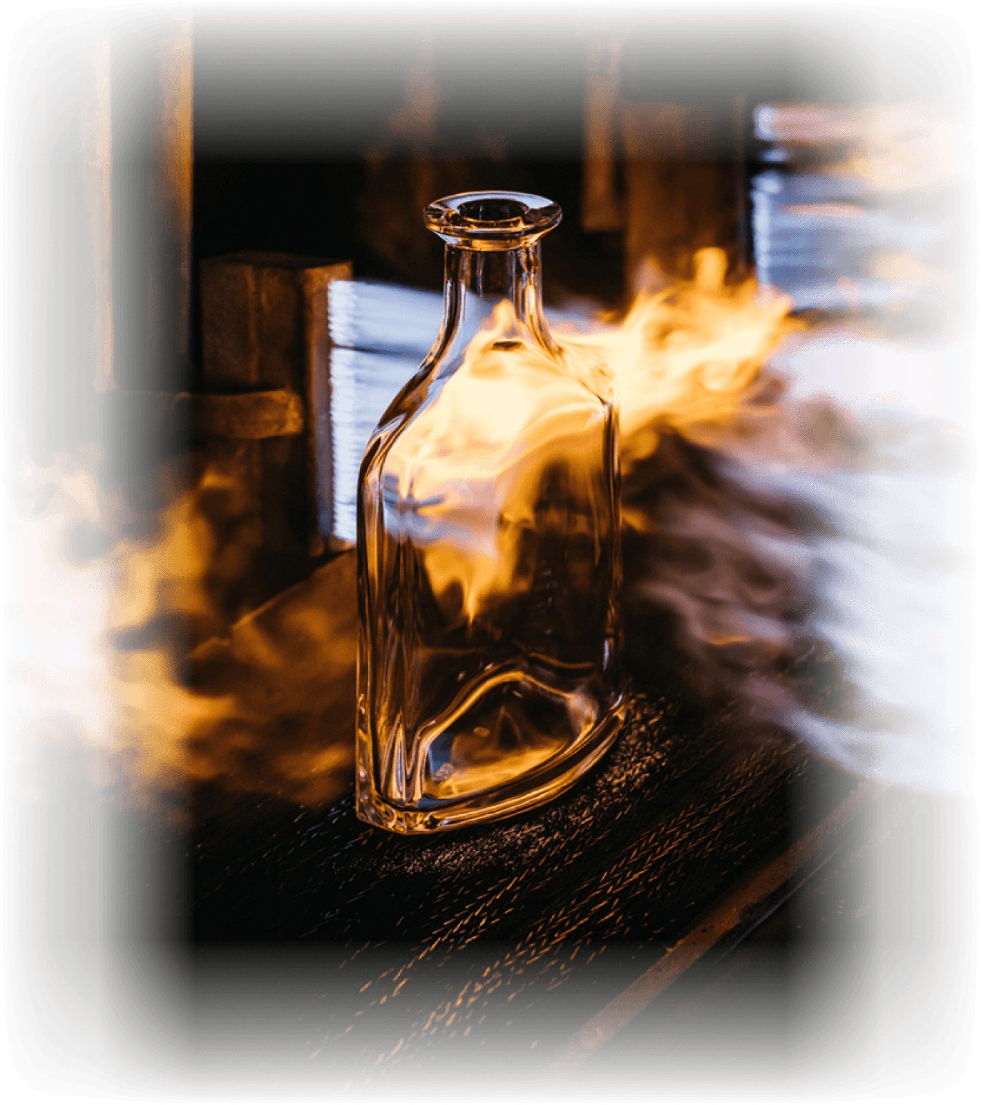 Glass bottle being formed in a glassmaking furnace